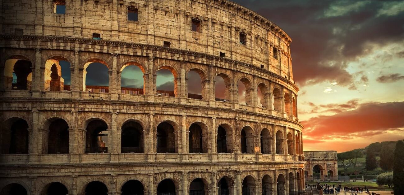 One of the most popular travel place in world – Roman Coliseum under evening sun light and sunrise sky.